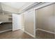 Large walk-in closet features built-in shelving, hardwood floors and natural light at 3600 E Bridger St, Pahrump, NV 89061