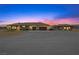 Sprawling ranch style home featuring a circular drive, attached garage, and mature landscaping at 3600 E Bridger St, Pahrump, NV 89061
