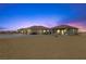 Well-maintained ranch-style home featuring multiple buildings, a large yard and circular drive at 3600 E Bridger St, Pahrump, NV 89061
