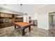 Spacious game room with a pool table, custom built-ins, and bar area, perfect for entertaining guests at 3600 E Bridger St, Pahrump, NV 89061