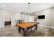 Large game room featuring a pool table with custom light fixture and a view of the backyard at 3600 E Bridger St, Pahrump, NV 89061