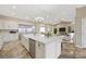 Bright kitchen with an island, stainless steel appliances, white cabinetry, and recessed lighting at 3600 E Bridger St, Pahrump, NV 89061