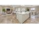 Bright, open-concept kitchen with large island, and seamless flow into the living and dining areas at 3600 E Bridger St, Pahrump, NV 89061