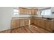 Well-lit kitchen with wood-look floors and granite countertops at 3600 E Bridger St, Pahrump, NV 89061