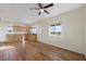 Living room featuring wood-look floors and kitchen area at 3600 E Bridger St, Pahrump, NV 89061