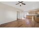 Bright living room with kitchen area and wood-look flooring at 3600 E Bridger St, Pahrump, NV 89061