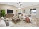 Bright and airy living room featuring stylish furnishings, a cozy fireplace, and ample natural light at 3600 E Bridger St, Pahrump, NV 89061