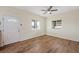 Bright living room featuring wood-look floors and multiple windows at 3600 E Bridger St, Pahrump, NV 89061