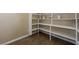 Pantry with bright white shelving and wood look floors at 3600 E Bridger St, Pahrump, NV 89061