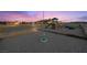 Backyard playground including slide, swings, bordered area, with home in the background at 3600 E Bridger St, Pahrump, NV 89061