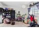 Cozy bedroom featuring natural light, desk, chair, and fitness equipment at 3632 Julia Waldene Ct, Las Vegas, NV 89129