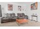 Comfortable living room featuring leather couches and a coffee table at 3632 Julia Waldene Ct, Las Vegas, NV 89129