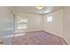 Inviting bedroom with cozy carpet and a large window, offering plenty of light at 3958 Blushing Hearts Rd, Las Vegas, NV 89115