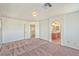 Bedroom featuring plush carpet, a doorway, and an archway leading to the ensuite bathroom at 3958 Blushing Hearts Rd, Las Vegas, NV 89115