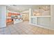 Open-concept living area flowing into a kitchen with a breakfast bar, great for entertaining at 3958 Blushing Hearts Rd, Las Vegas, NV 89115