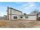 Back exterior view of home with access door and chimney at 4155 Comb Cir, Las Vegas, NV 89104