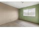 Bedroom with a combination of beige and green walls and carpeted floors at 4155 Comb Cir, Las Vegas, NV 89104