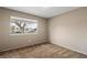 Bedroom with neutral walls and a window overlooking the neighborhood at 4155 Comb Cir, Las Vegas, NV 89104