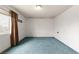 Spacious bedroom with blue carpet, window, and neutral walls at 4155 Comb Cir, Las Vegas, NV 89104