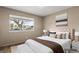 Virtually staged bedroom with neutral walls, staging, and a neighborhood view at 4155 Comb Cir, Las Vegas, NV 89104