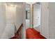 Hallway with stairs and a view into an adjacent room, painted in neutral tones at 4155 Comb Cir, Las Vegas, NV 89104
