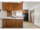 Kitchen with wooden cabinetry and stainless steel appliances at 4155 Comb Cir, Las Vegas, NV 89104