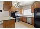 Open concept kitchen with stainless appliances and a view to an adjacent room at 4155 Comb Cir, Las Vegas, NV 89104