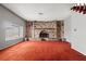 Cozy living room featuring a large brick fireplace and mantel beneath a window at 4155 Comb Cir, Las Vegas, NV 89104