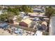 This backyard view displays multiple sheds, vehicles and equipment stored in the rear of the property at 4300 Thom Blvd, Las Vegas, NV 89130