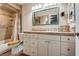 Bathroom with built-in vanity, granite countertop, and a tiled shower and tub at 4300 Thom Blvd, Las Vegas, NV 89130