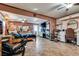 Large bedroom featuring tile flooring, a queen bed, sitting area, and ceiling fans at 4300 Thom Blvd, Las Vegas, NV 89130