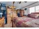 Bedroom featuring a four-poster bed, tile floors, and custom built-ins at 4300 Thom Blvd, Las Vegas, NV 89130