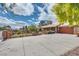 Exterior view of a charming single-story home with a long driveway at 4300 Thom Blvd, Las Vegas, NV 89130