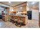 Kitchen with granite counters, light wood cabinetry, and breakfast bar with seating at 4300 Thom Blvd, Las Vegas, NV 89130