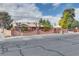 Home with a unique fence and mature trees, giving it a private and inviting curb appeal at 4300 Thom Blvd, Las Vegas, NV 89130