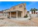 Spacious backyard with covered patio and desert landscaping, perfect for relaxation at 4431 Palm Mesa Dr, Las Vegas, NV 89120