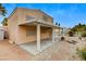An inviting backyard featuring a covered patio and desert landscaping at 4431 Palm Mesa Dr, Las Vegas, NV 89120