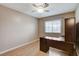Bedroom with bright natural light, ceiling fan and neutral walls, complemented by a contemporary style desk at 4431 Palm Mesa Dr, Las Vegas, NV 89120