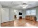 Bedroom featuring hardwood floors, TV, and ample natural light at 4431 Palm Mesa Dr, Las Vegas, NV 89120