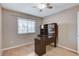 Bedroom featuring a ceiling fan, a window offering natural light, and a desk with storage shelves at 4431 Palm Mesa Dr, Las Vegas, NV 89120