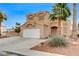 Two-story home with desert landscaping, driveway, and a two-car garage at 4431 Palm Mesa Dr, Las Vegas, NV 89120