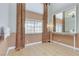 The foyer features neutral walls, tile flooring and a large mirror above the built-in shelf at 4431 Palm Mesa Dr, Las Vegas, NV 89120