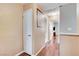 Upstairs hallway with wood floors and multiple doors at 4431 Palm Mesa Dr, Las Vegas, NV 89120