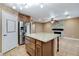 Stylish kitchen with island, stainless steel appliances and tile floor at 4431 Palm Mesa Dr, Las Vegas, NV 89120