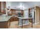Modern kitchen featuring an island, granite countertops, stainless steel appliances, and stylish lighting at 4431 Palm Mesa Dr, Las Vegas, NV 89120