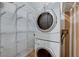 Laundry room with stackable washer/dryer and wire shelving at 4431 Palm Mesa Dr, Las Vegas, NV 89120