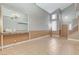 Bright living room featuring high ceilings, tile flooring, and natural light from large windows at 4431 Palm Mesa Dr, Las Vegas, NV 89120