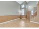 Open-concept living room with tile floors and view of front entrance at 4431 Palm Mesa Dr, Las Vegas, NV 89120