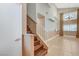 Light filled living room with high ceilings, tile floors and staircase to second floor at 4431 Palm Mesa Dr, Las Vegas, NV 89120