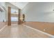Open-concept living room featuring high ceilings, tile floors and decorative lighting at 4431 Palm Mesa Dr, Las Vegas, NV 89120